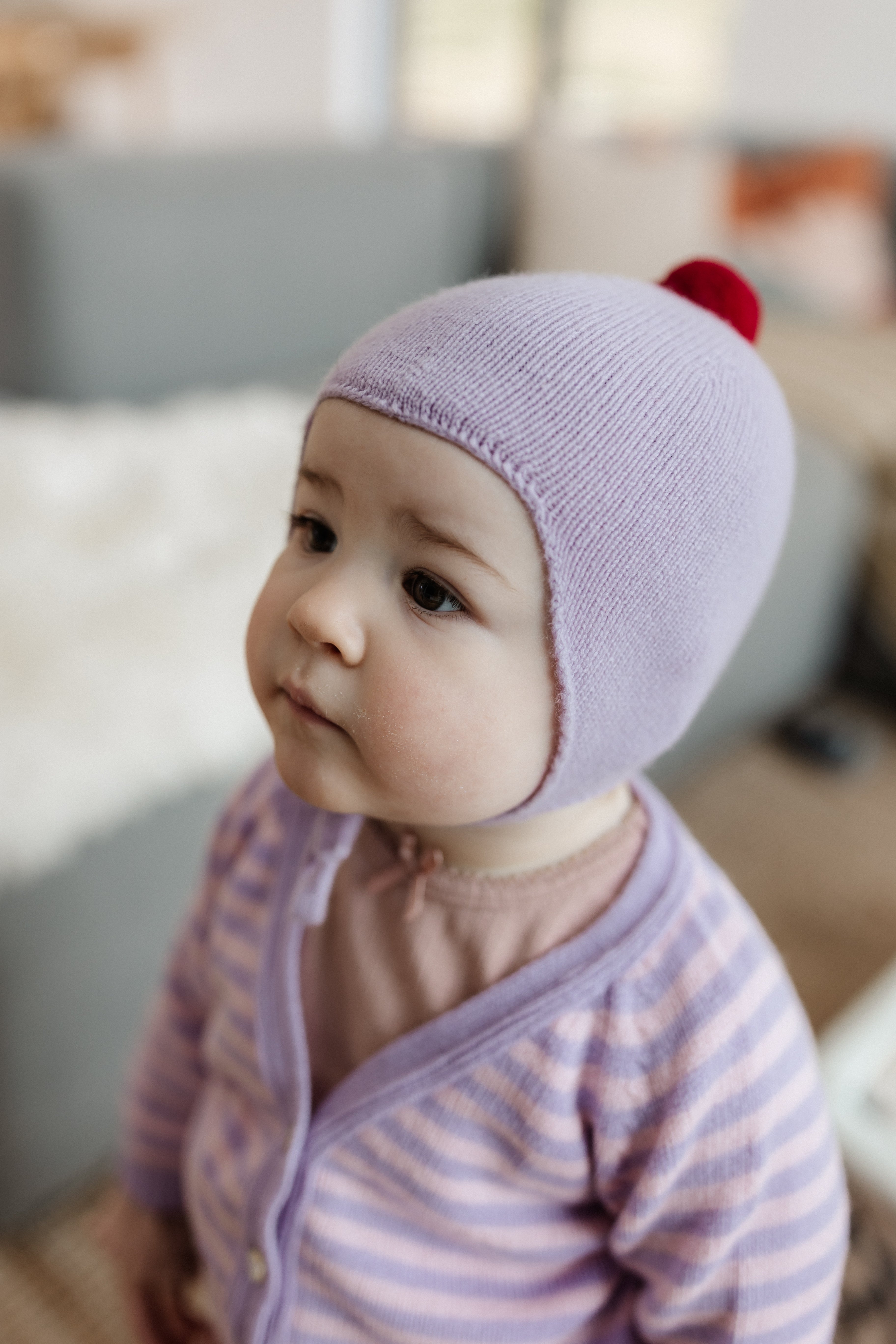 Rosie Sugden Cashmere's Baby Bonnet in Lupin with Chianti Pom-Pom