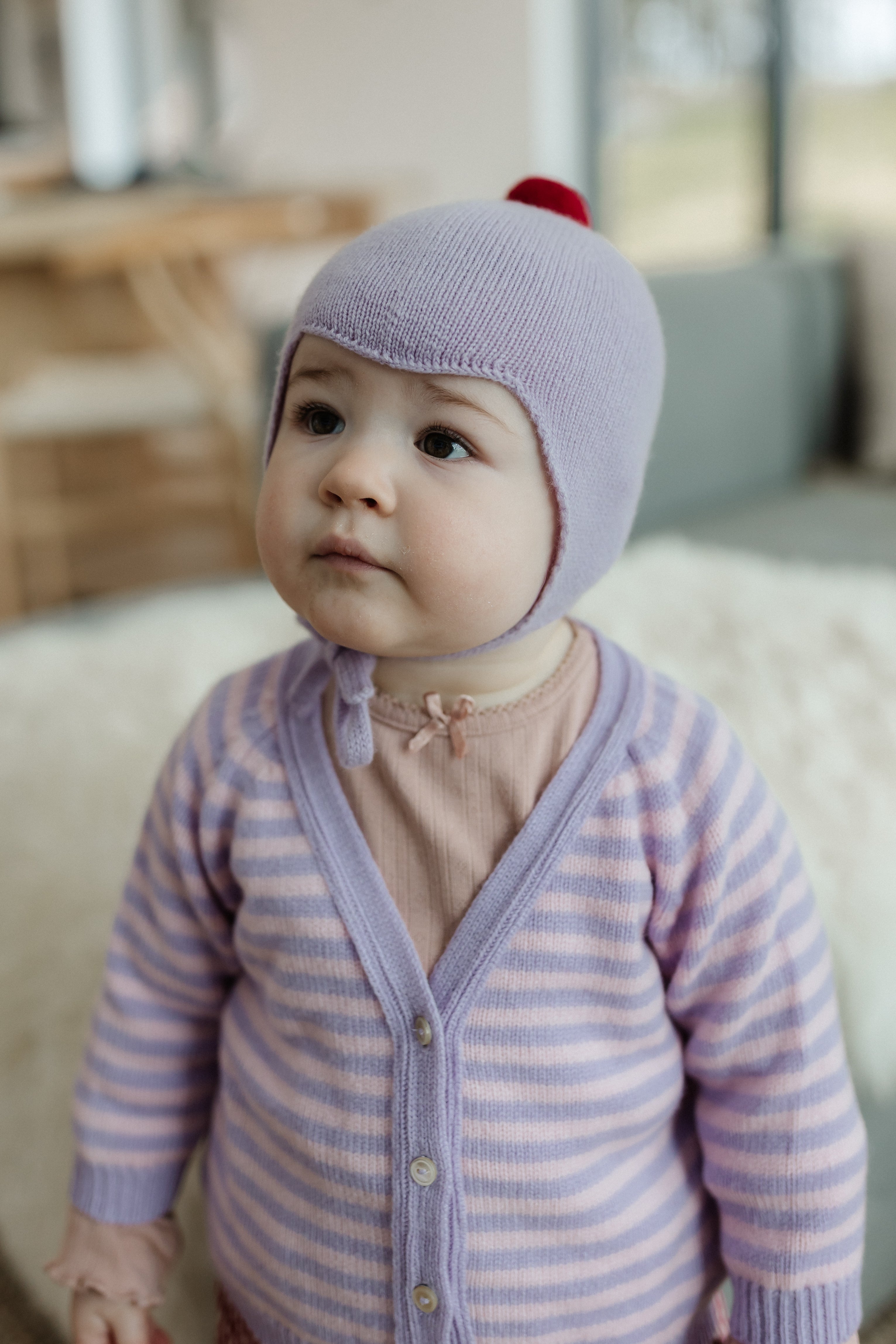 Rosie Sugden Cashmere's Baby Bonnet in Lupin with Chianti Pom-Pom