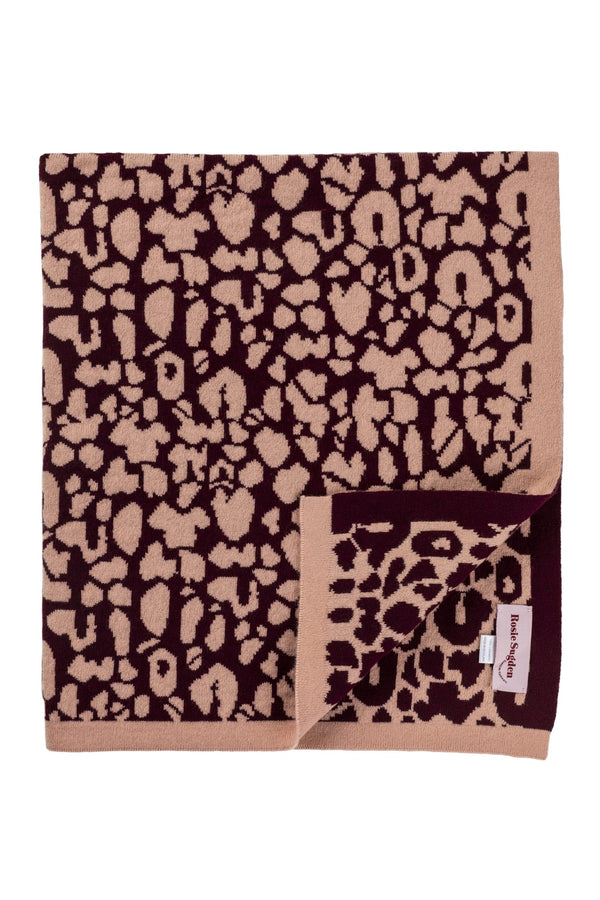 Rosie Sugden Cashmere’s Leopard Baby Blanket in Coral & Damson
